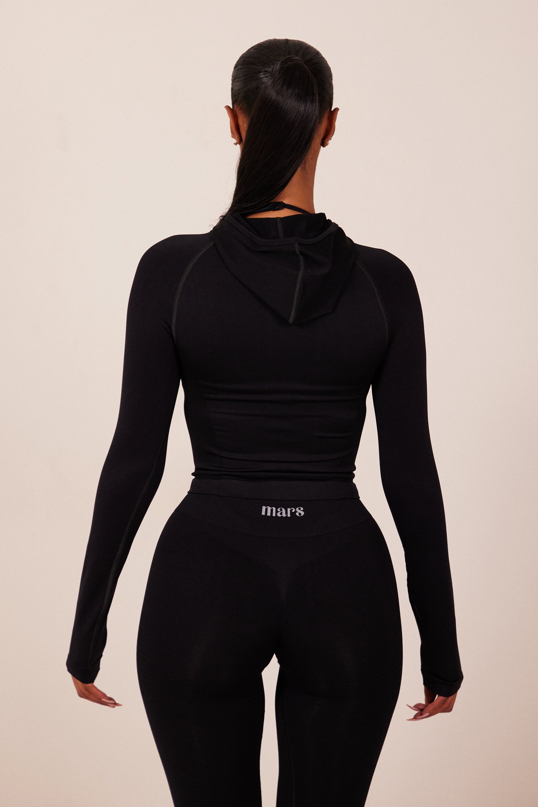 The Mars Seamless Hooded Zip Jacket in Black